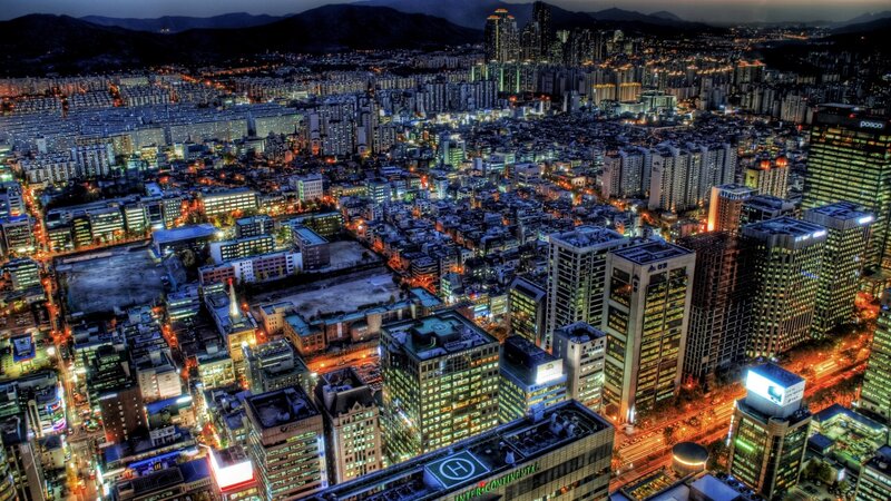 Nighttime Cityscape View — Blue, Dramatic, Night, Photograph, Buildings, Mountains