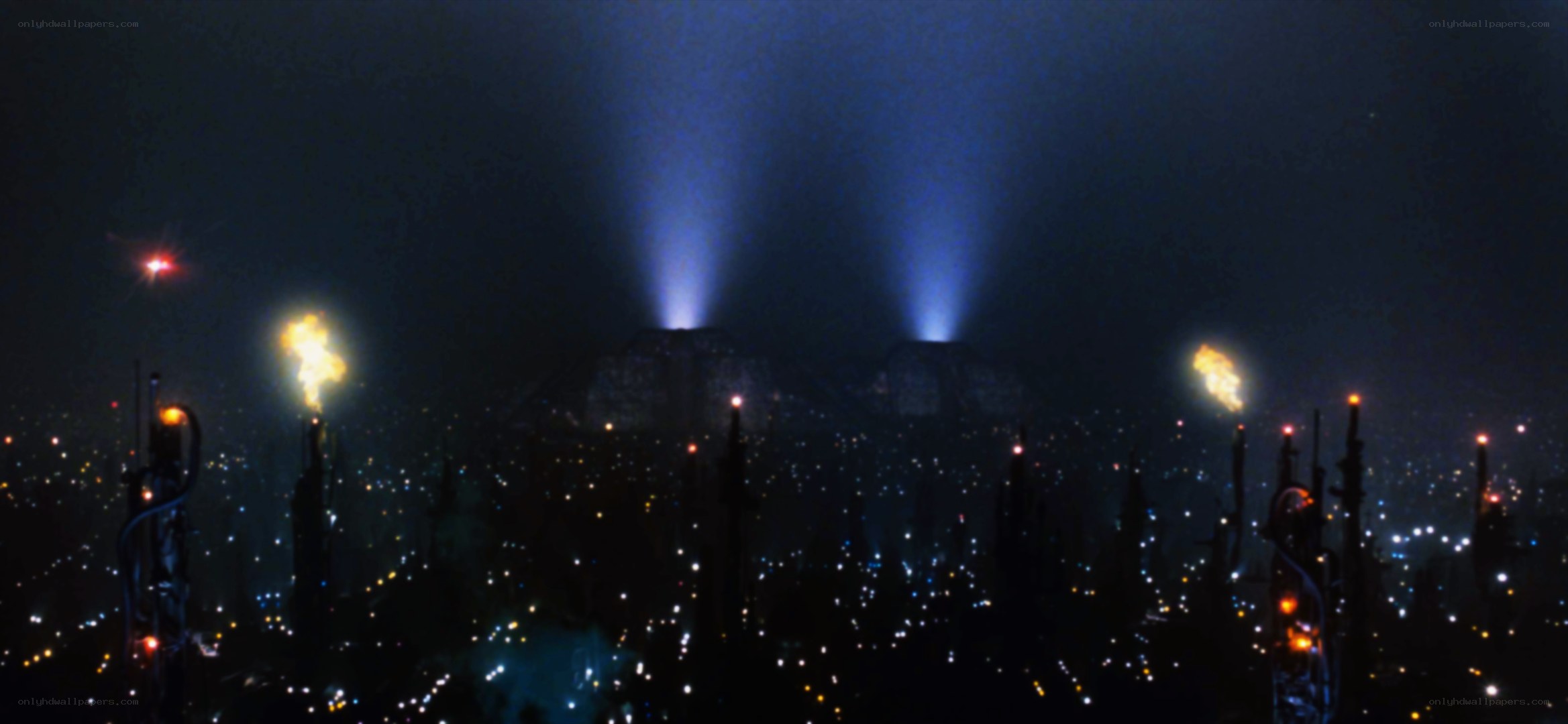 nighttime cityscape with beams