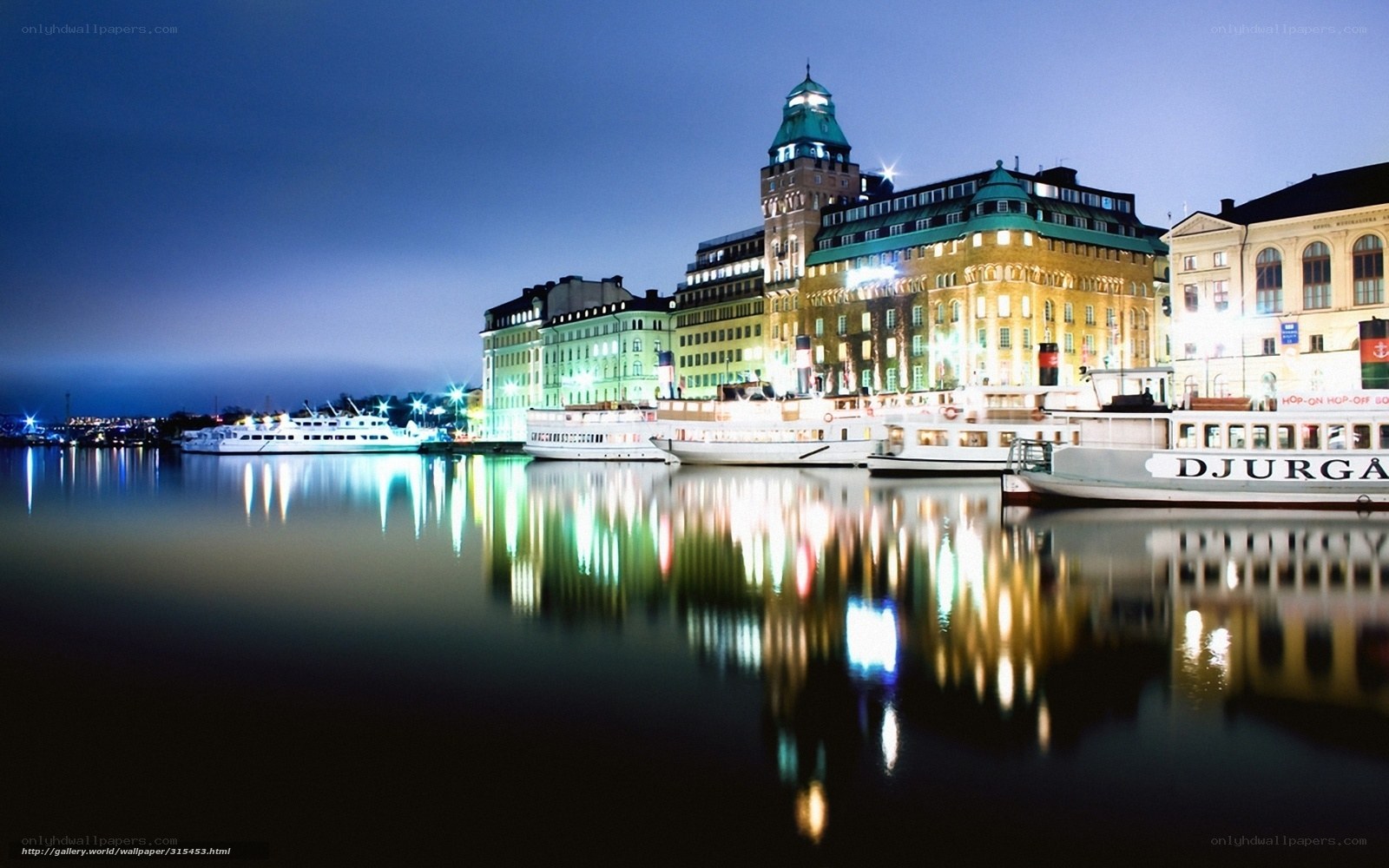 Nighttime cityscape with boats