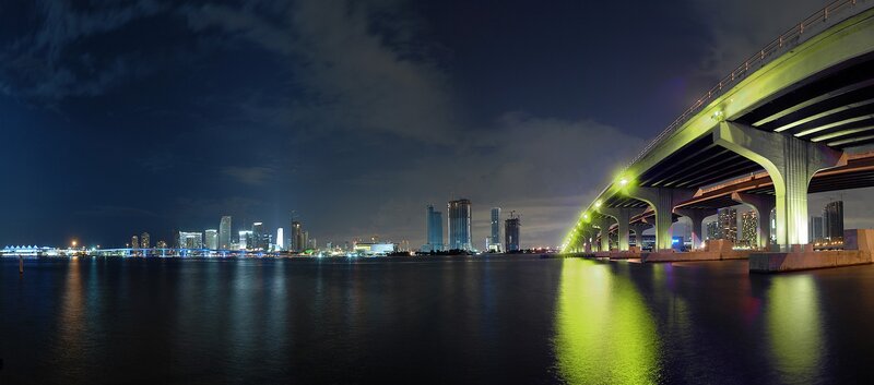 nighttime cityscape with bridge