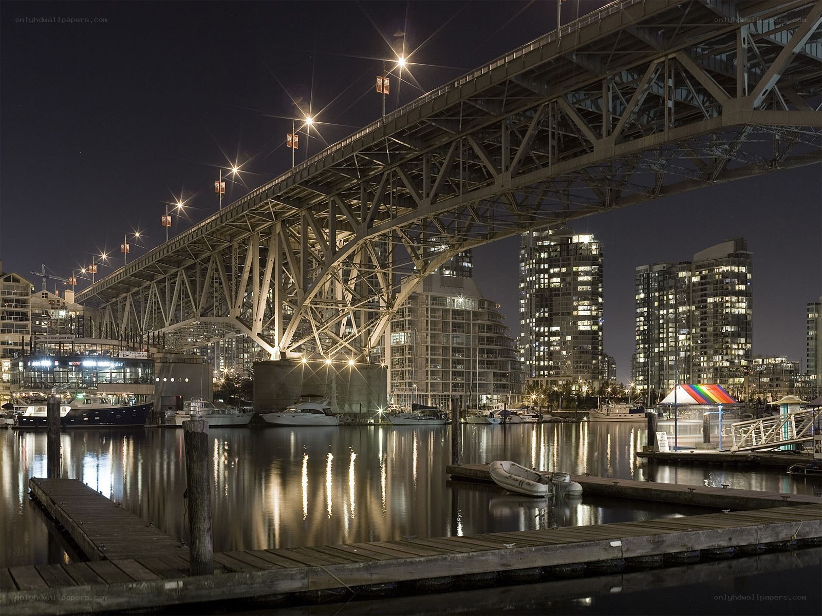 Nighttime cityscape with bridge