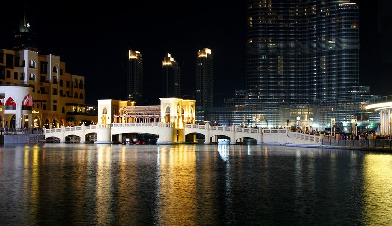 nighttime cityscape with bridge