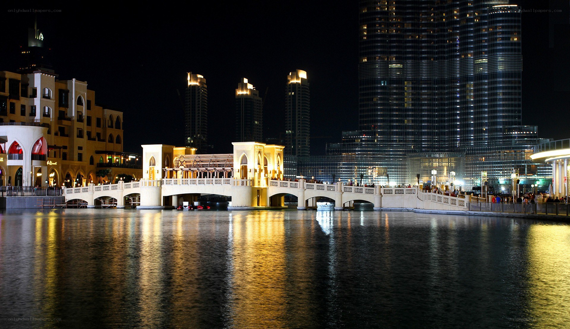 nighttime cityscape with bridge