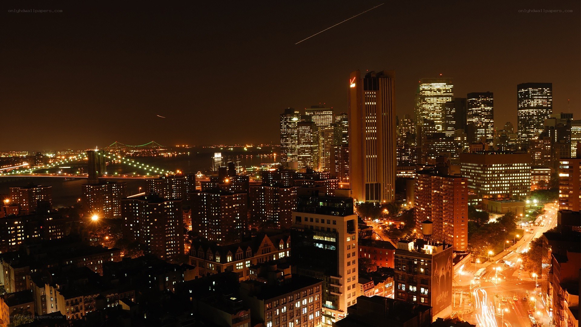 nighttime cityscape with bridge