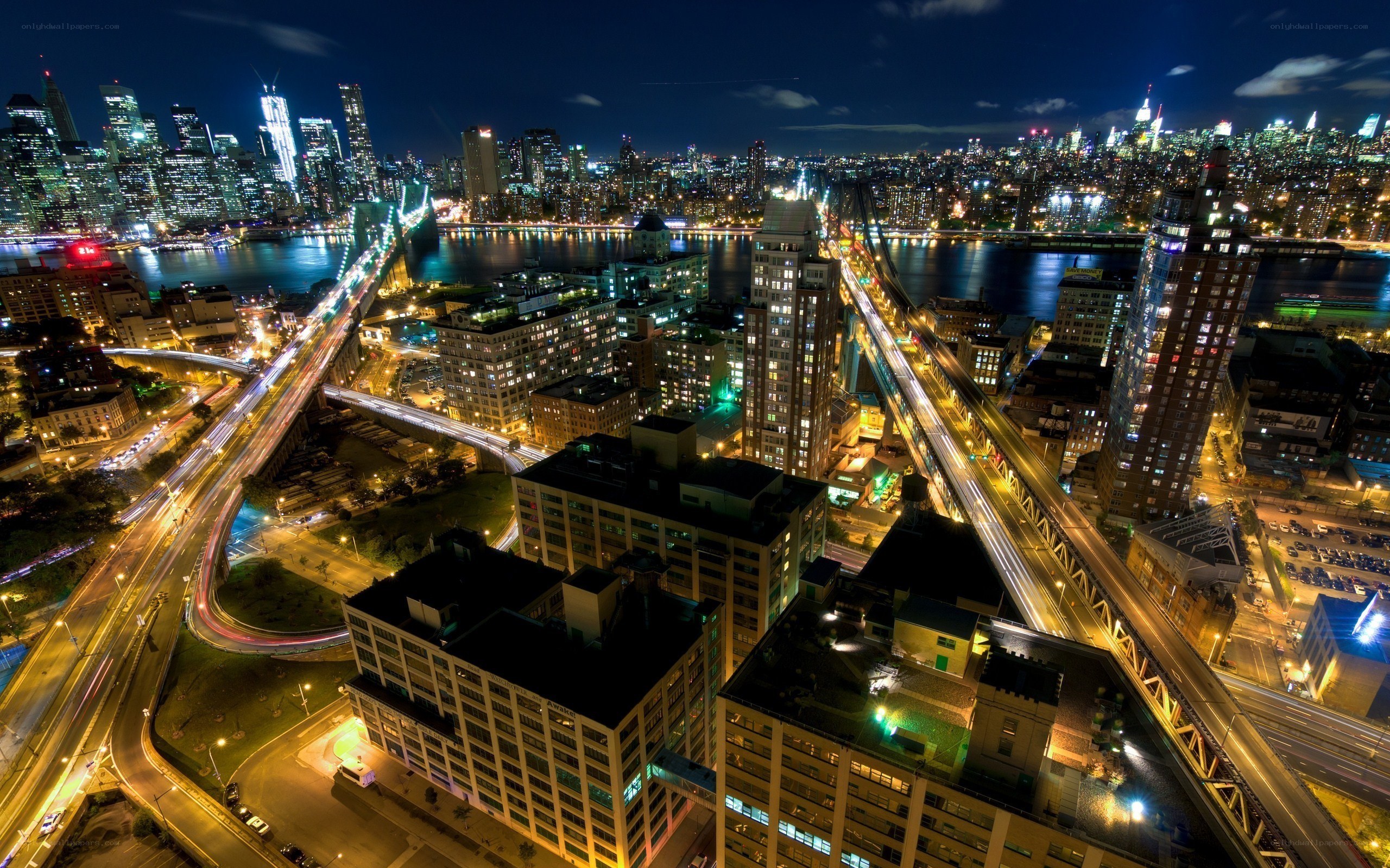 nighttime cityscape with bridges