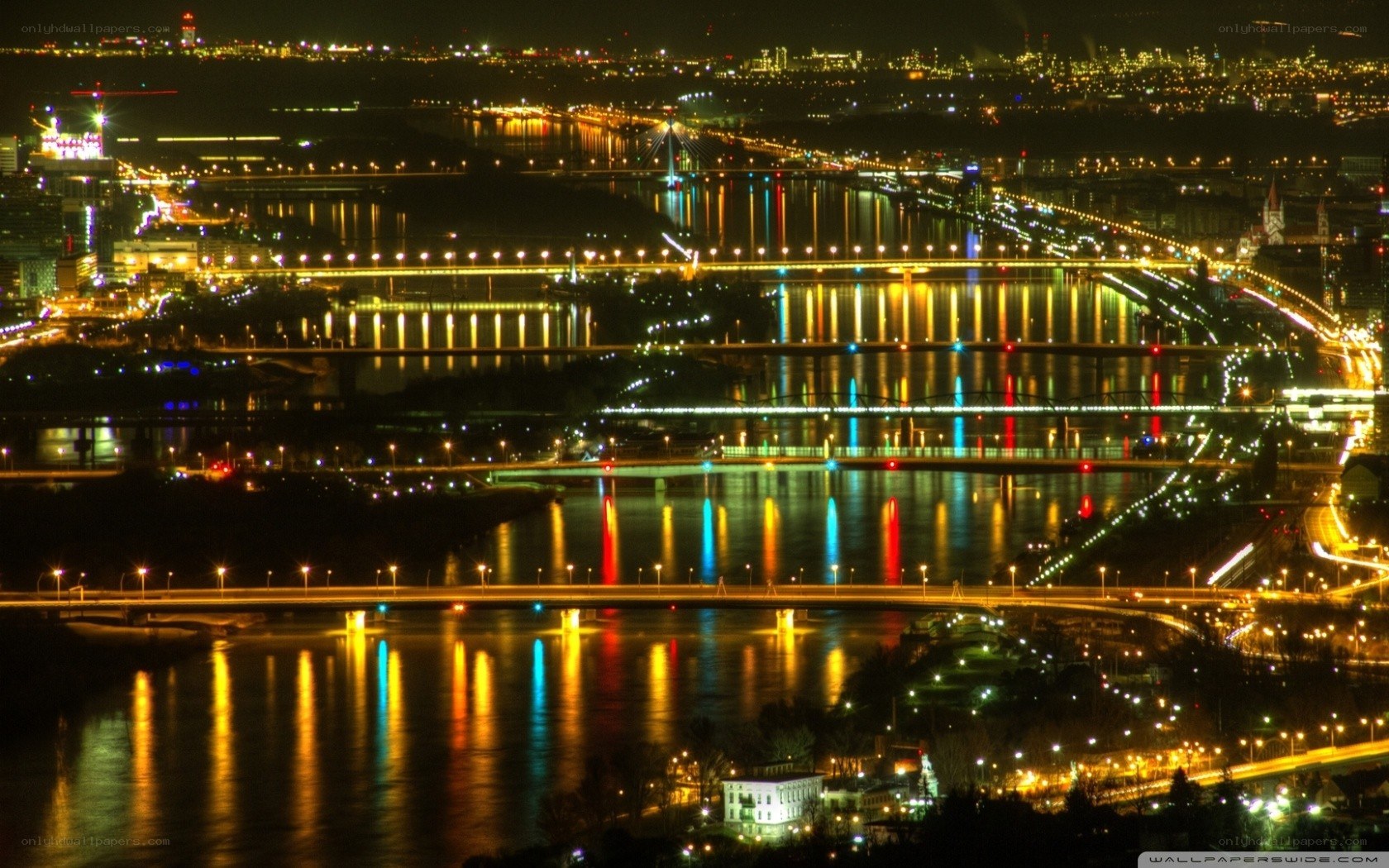 nighttime cityscape with bridges