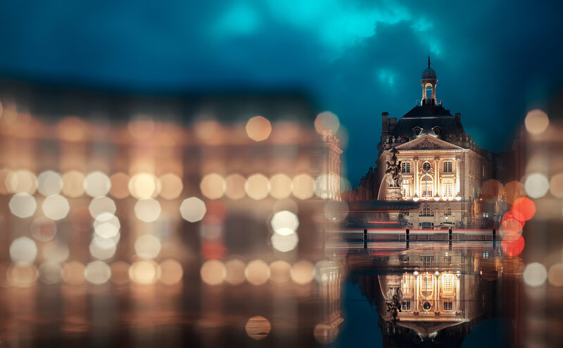 Nighttime cityscape with building reflection