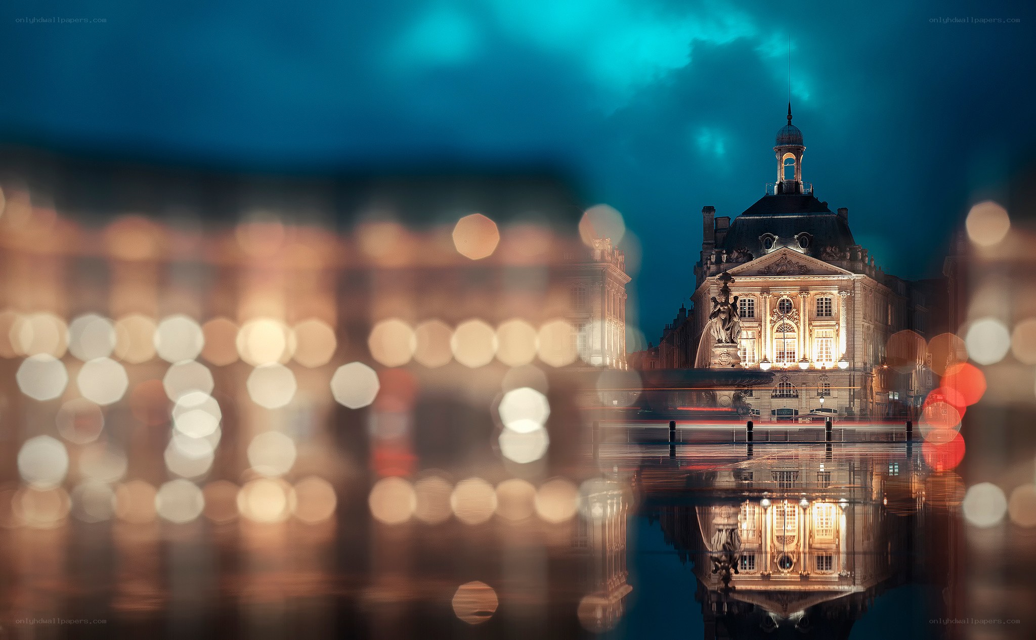 Nighttime cityscape with building reflection
