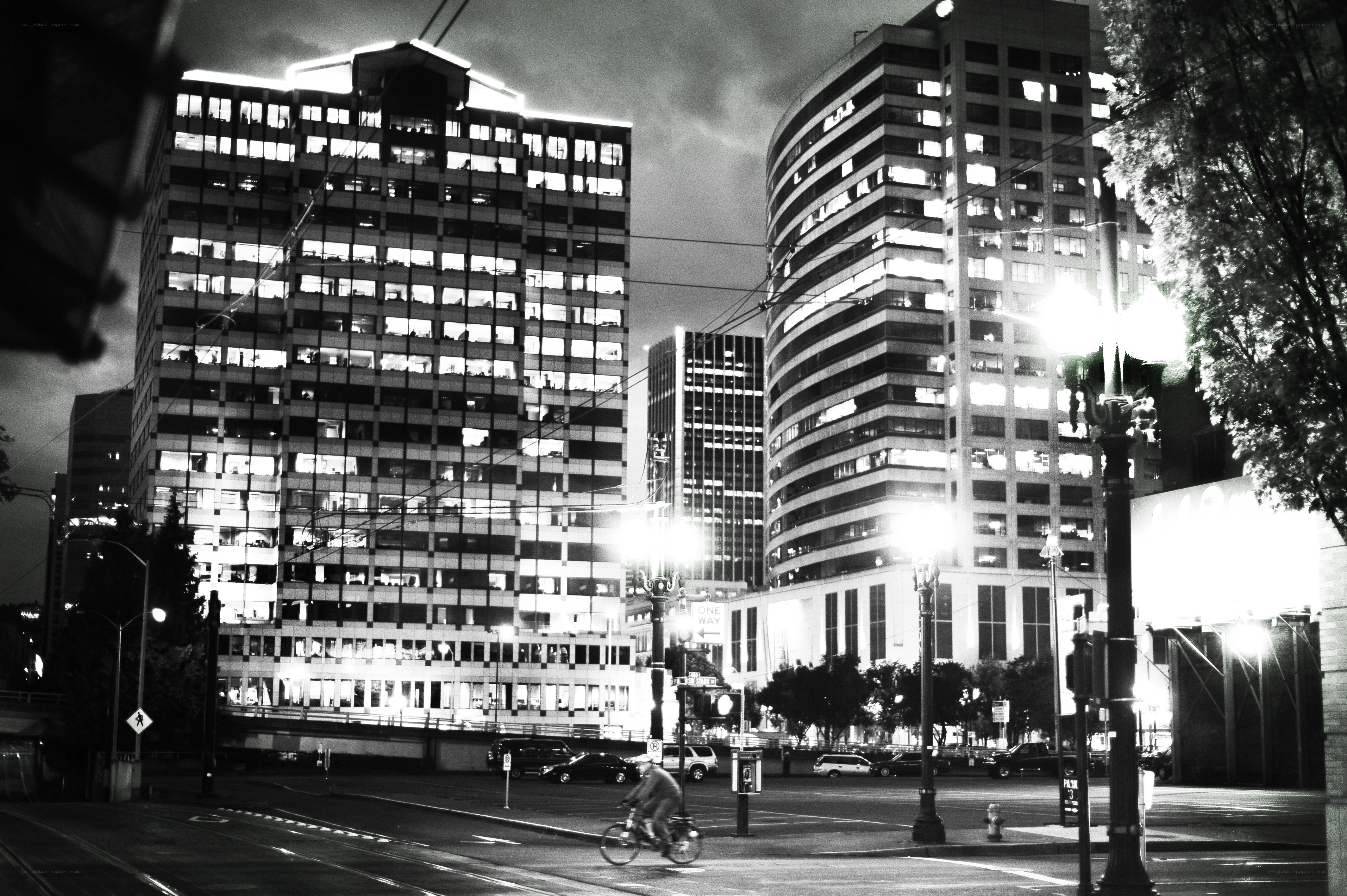Nighttime cityscape with cyclists
