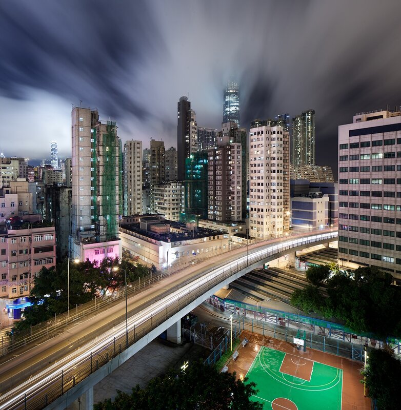 Nighttime cityscape with elevated highway