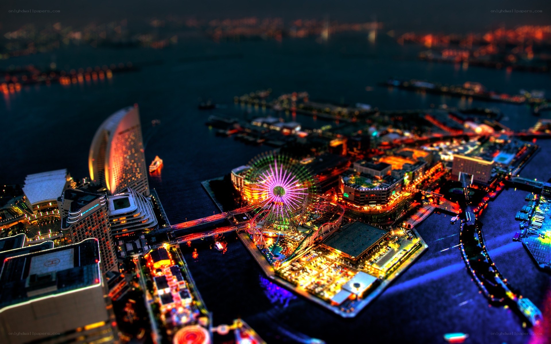 nighttime cityscape with ferris wheel