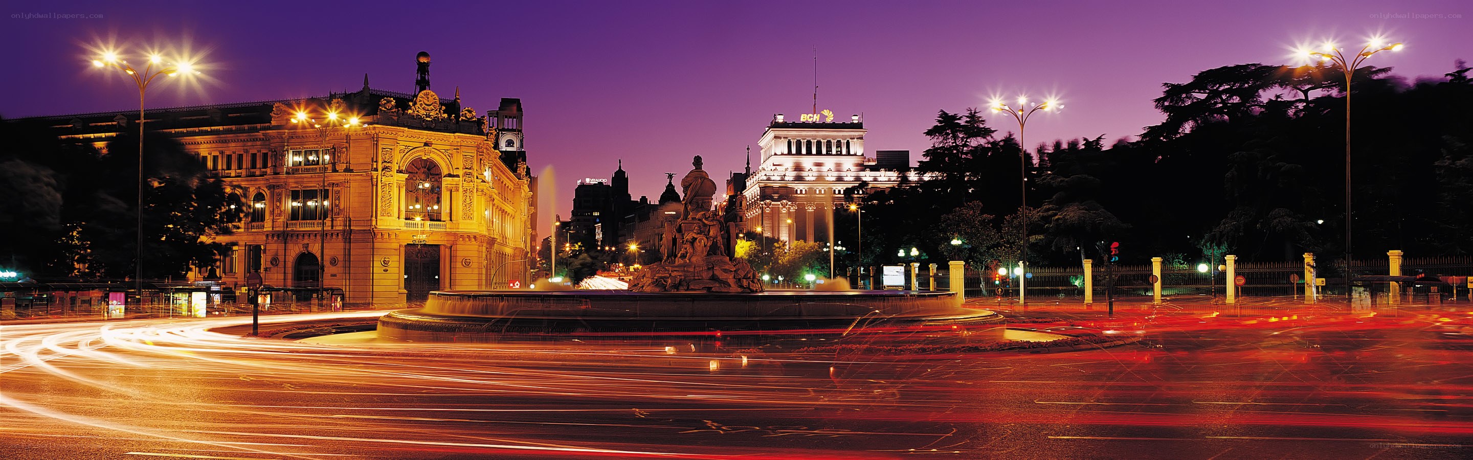 nighttime cityscape with fountain
