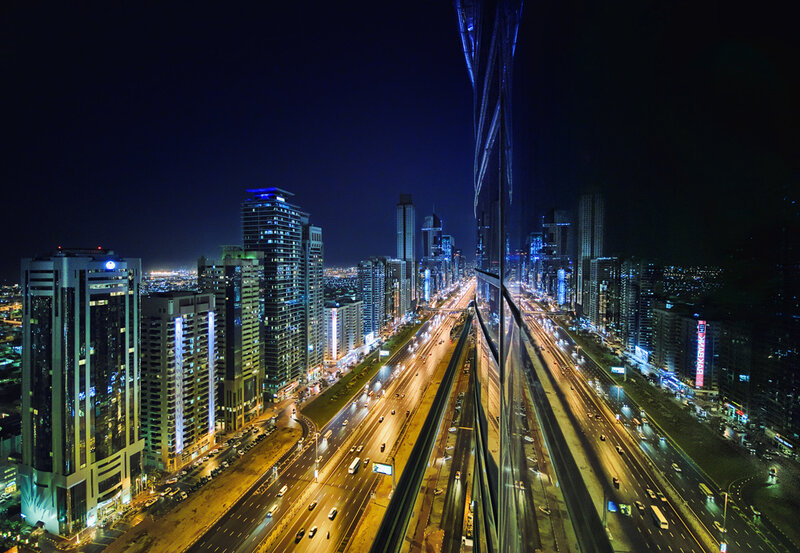 nighttime cityscape with highways