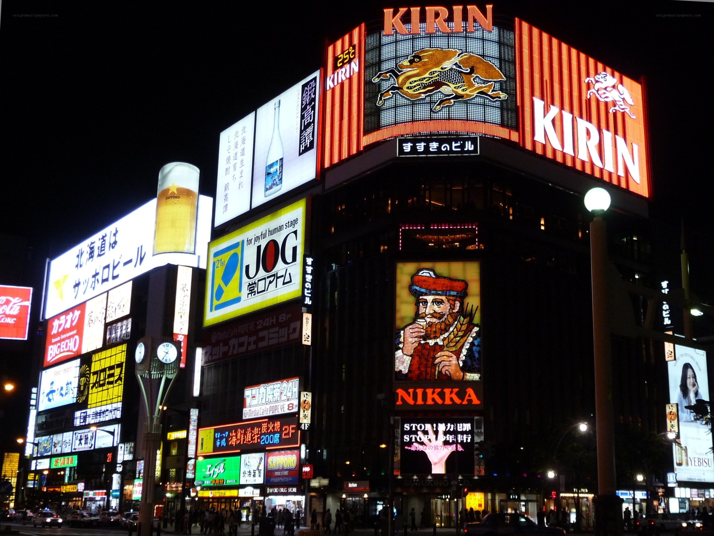 Nighttime cityscape with illuminated billboards