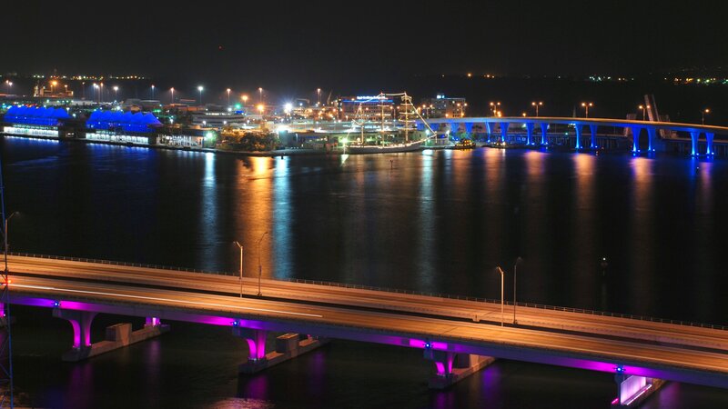 nighttime cityscape with illuminated bridges