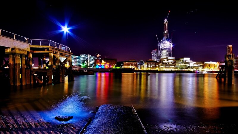 Nighttime cityscape with illuminated buildings