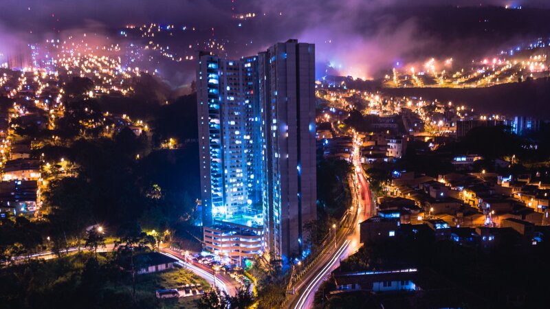 nighttime cityscape with illuminated buildings