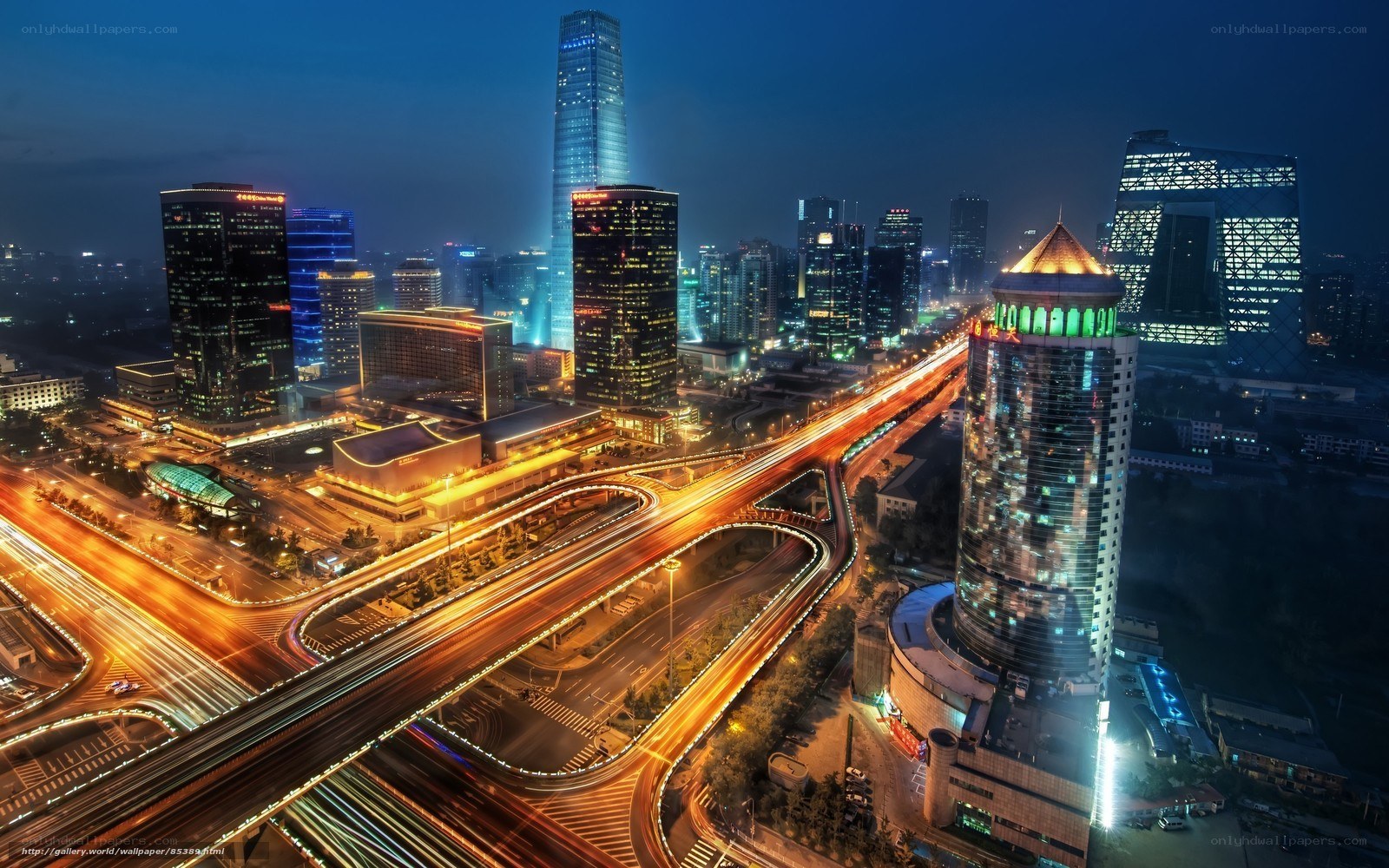 Nighttime cityscape with illuminated highways