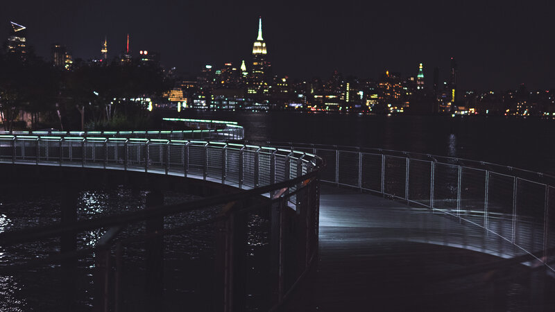 nighttime cityscape with illuminated skyline