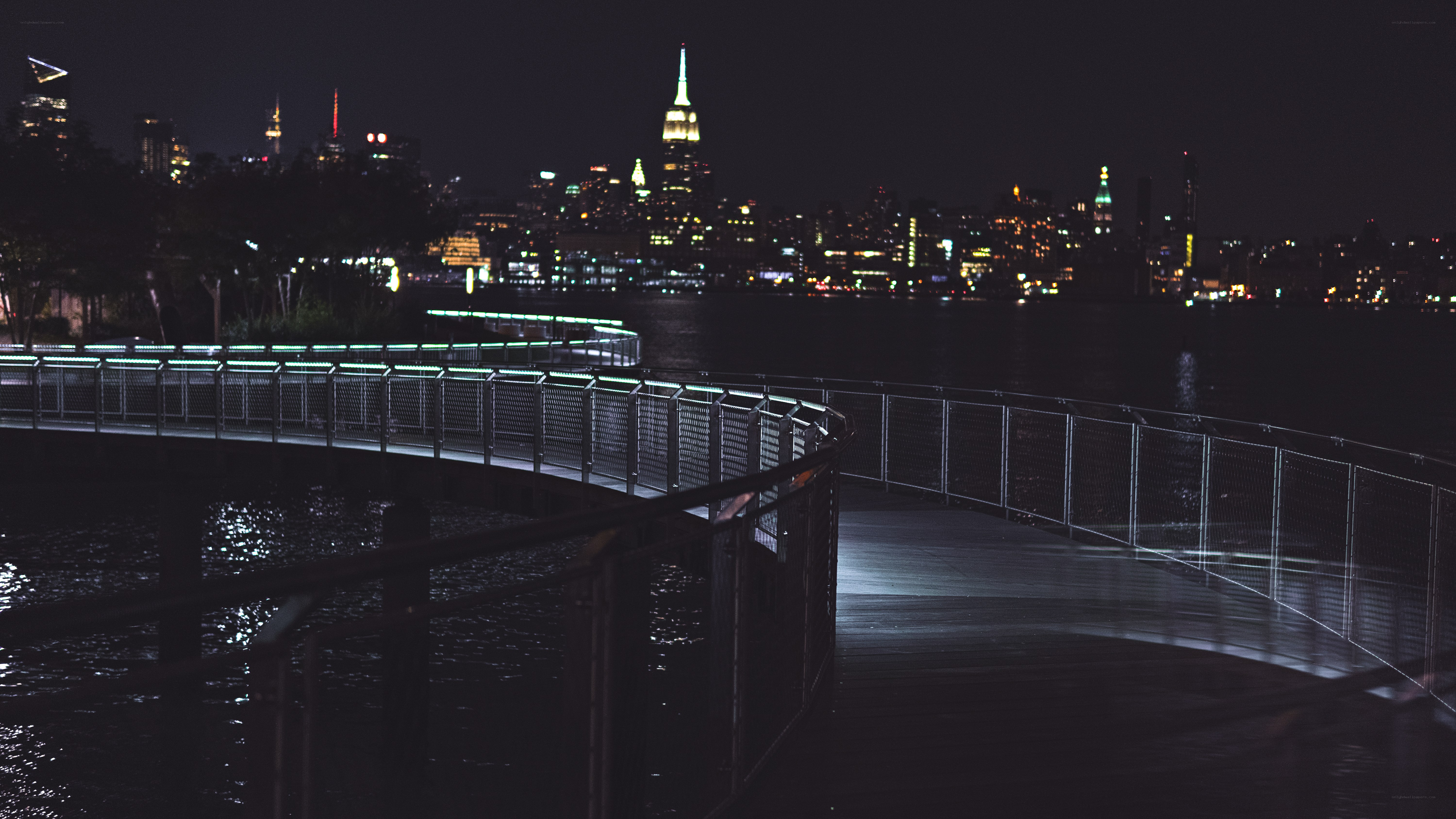 nighttime cityscape with illuminated skyline
