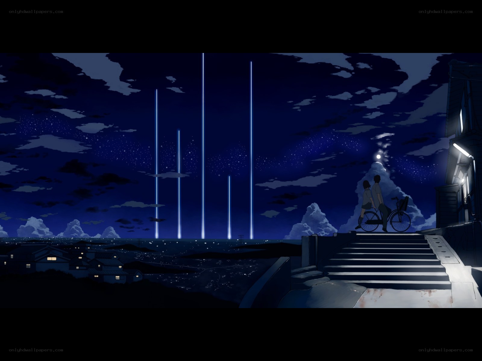 Nighttime cityscape with light beams