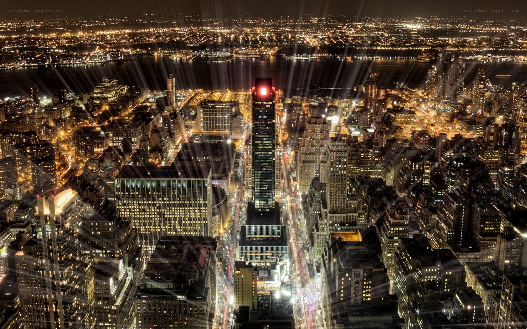 Nighttime cityscape with light beams