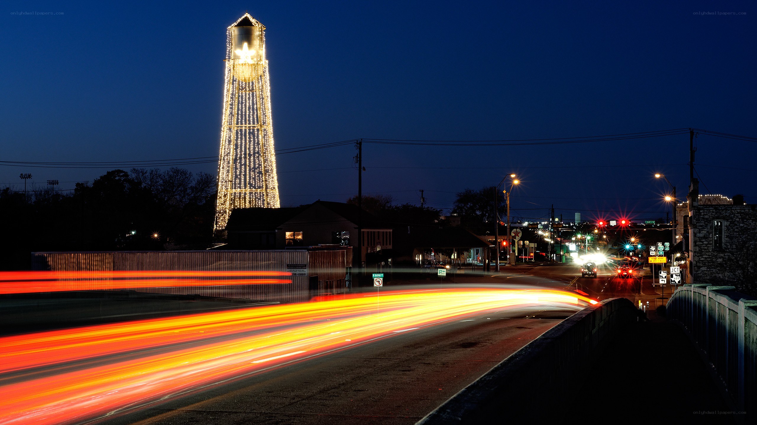 Nighttime cityscape with light trails