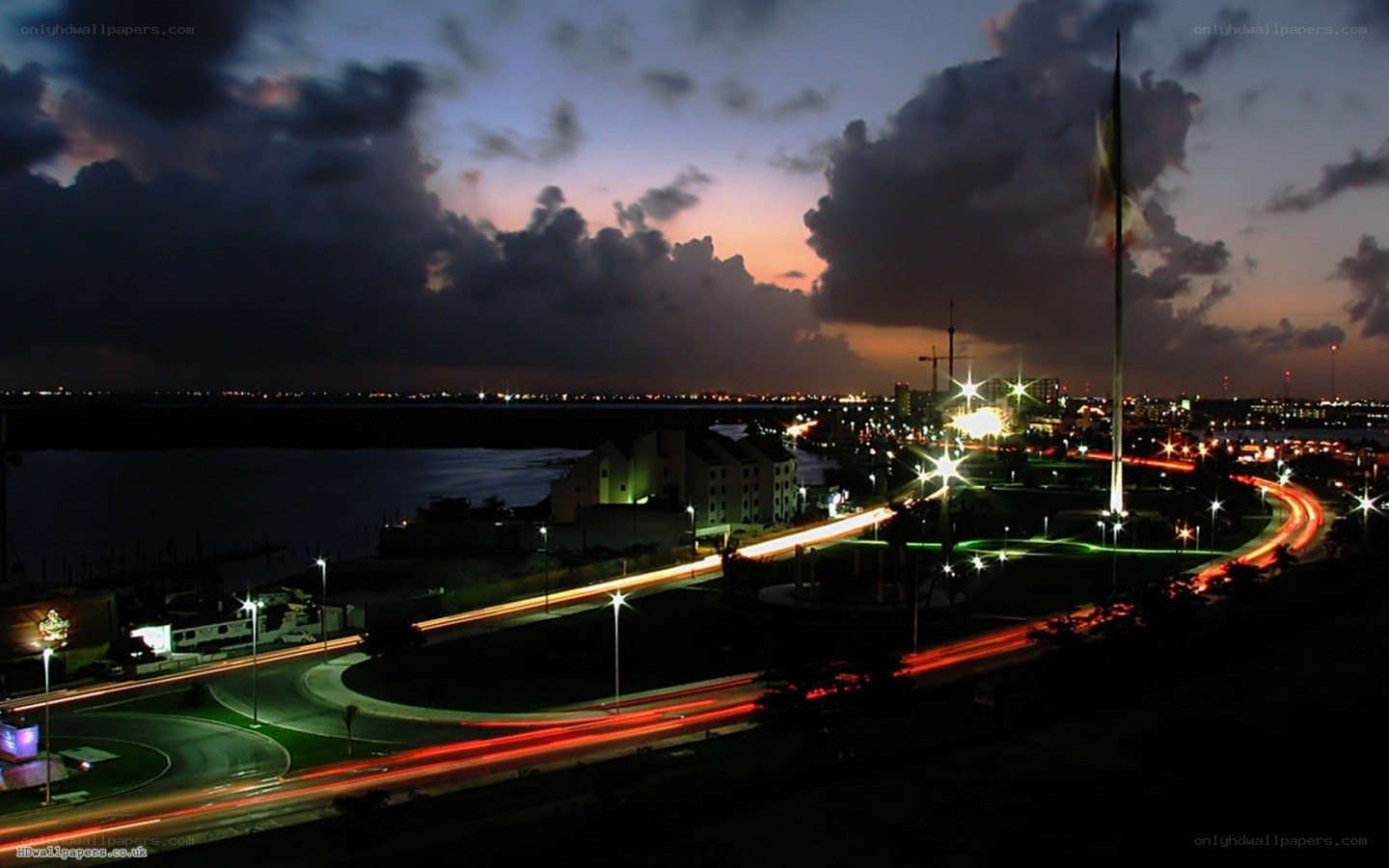 Nighttime cityscape with light trails