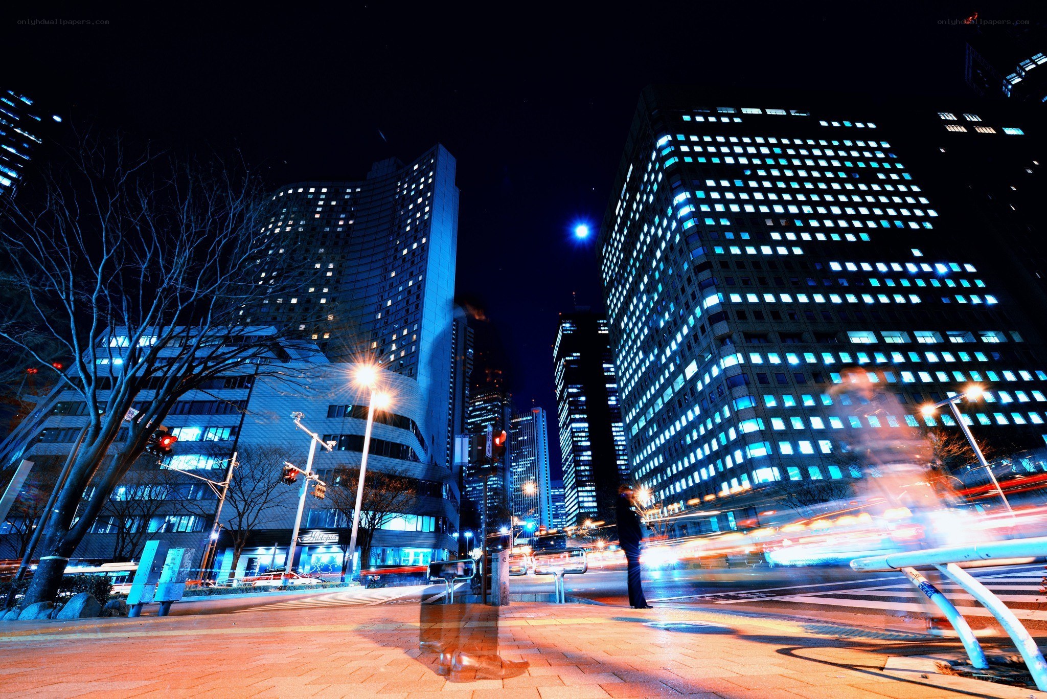 nighttime cityscape with light trails