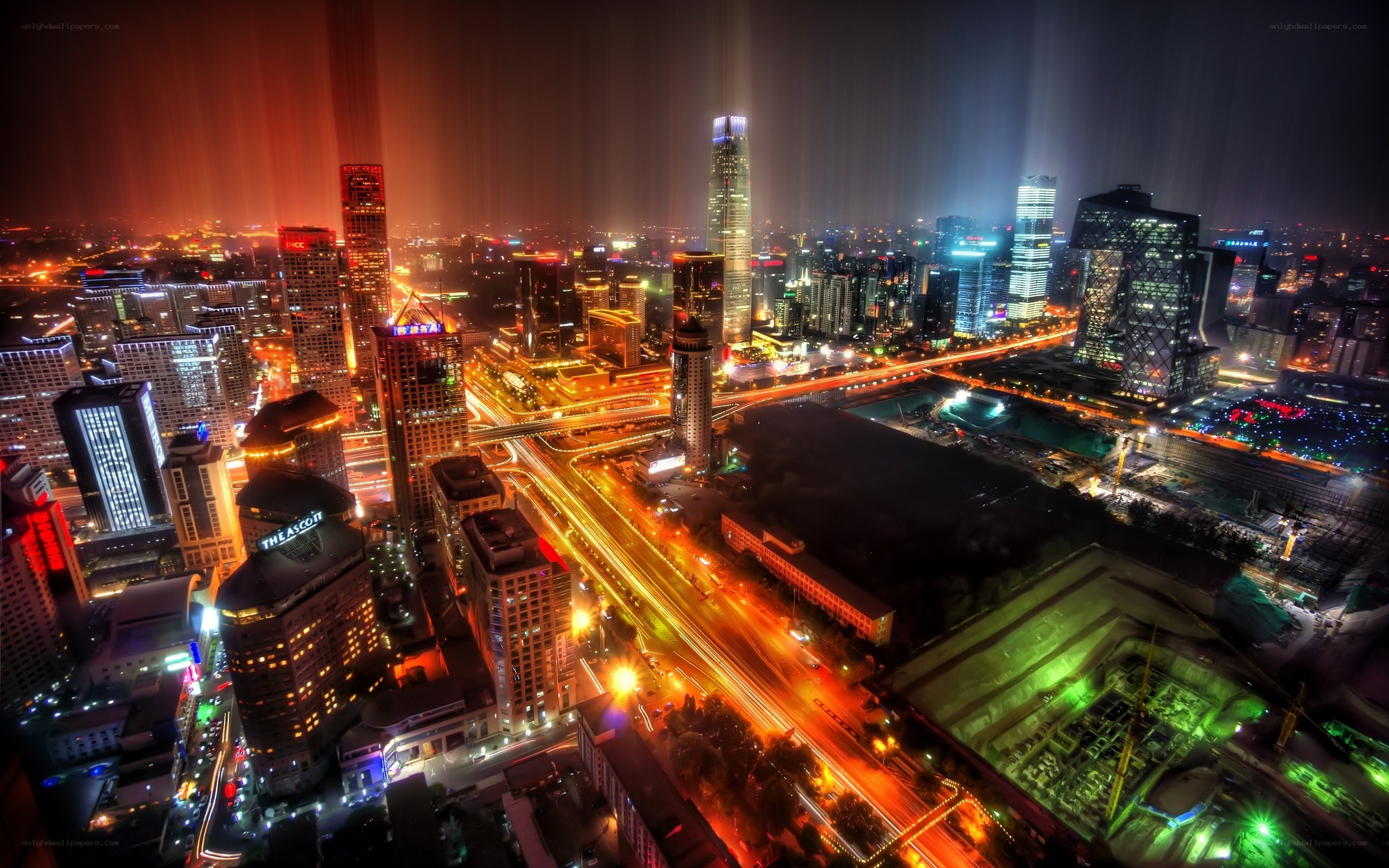 nighttime cityscape with light trails