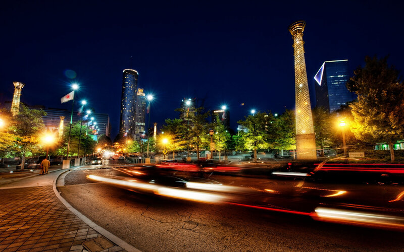 Nighttime cityscape with light trails