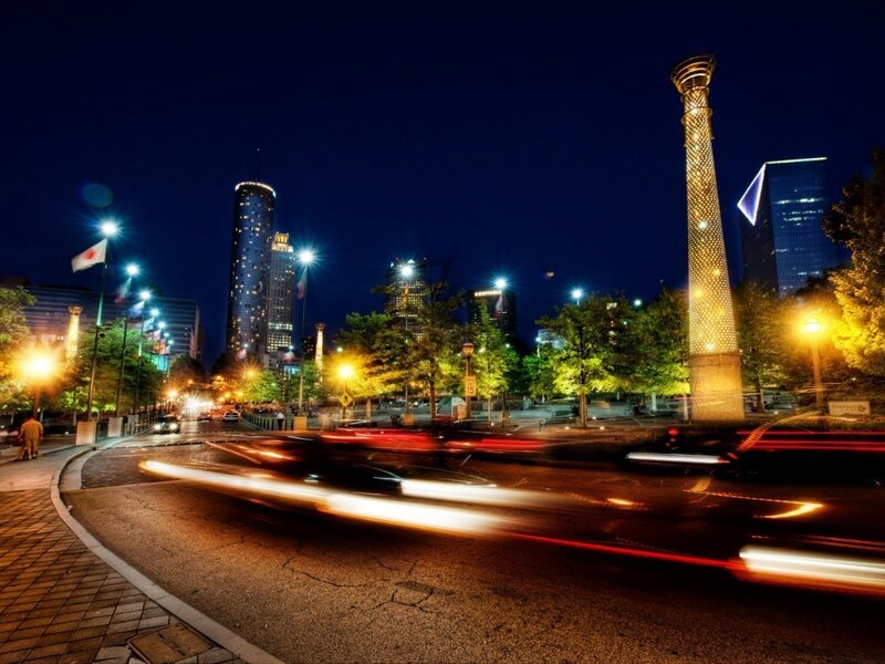 Nighttime cityscape with light trails