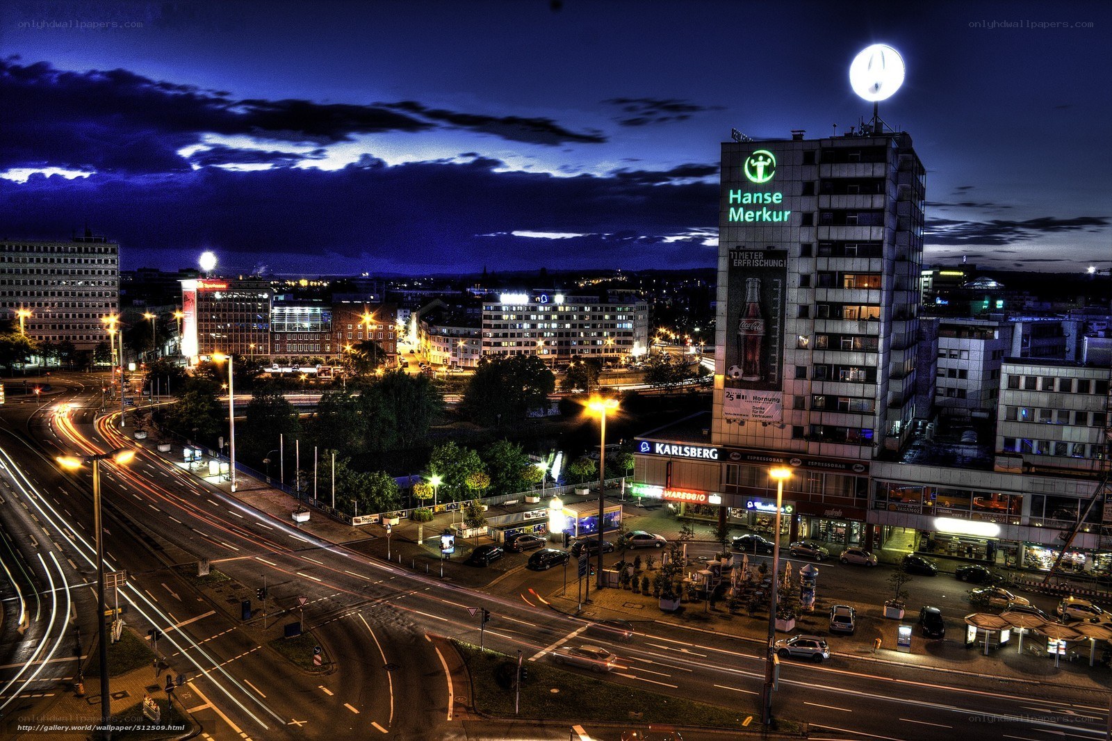 Nighttime cityscape with light trails