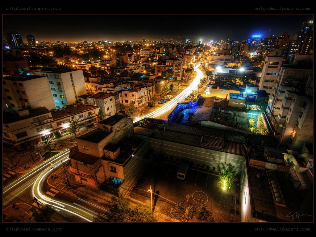 nighttime cityscape with light trails