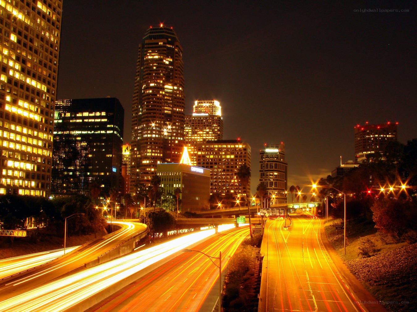 Nighttime cityscape with light trails