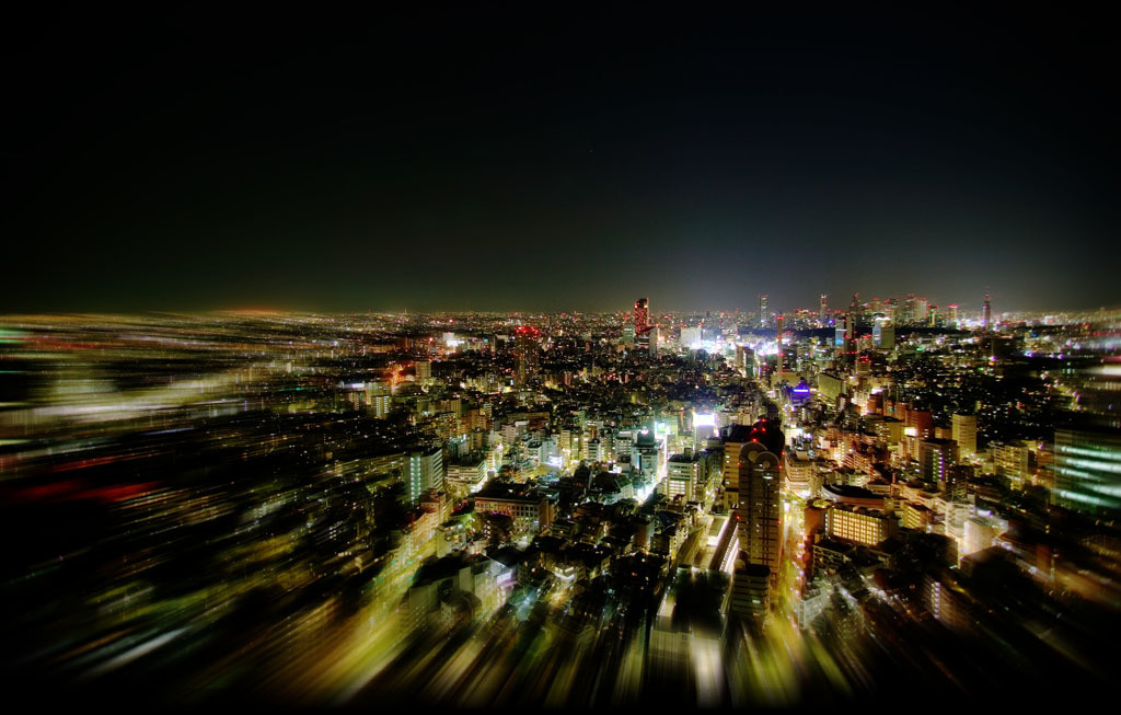 nighttime cityscape with light trails