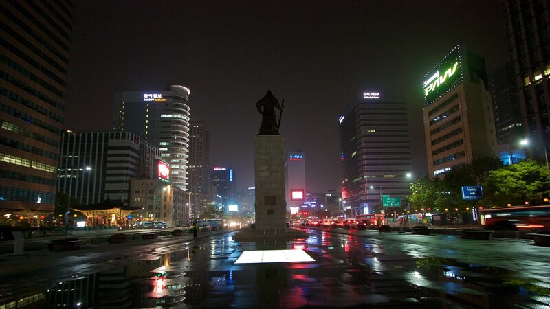 nighttime cityscape with monument