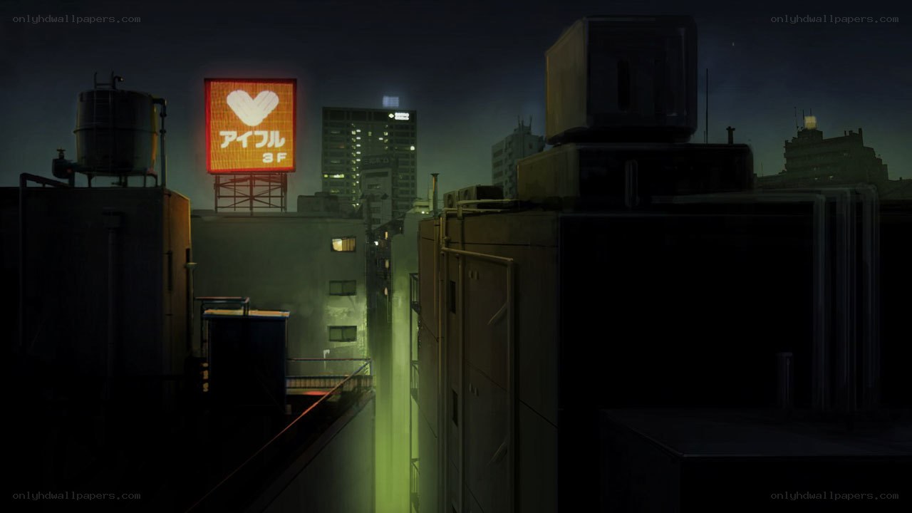 nighttime cityscape with neon sign