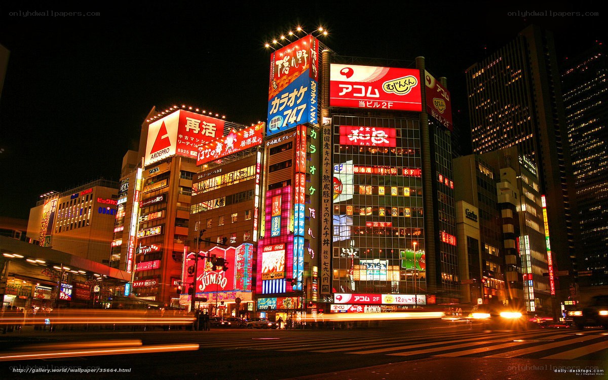 nighttime cityscape with neon signs