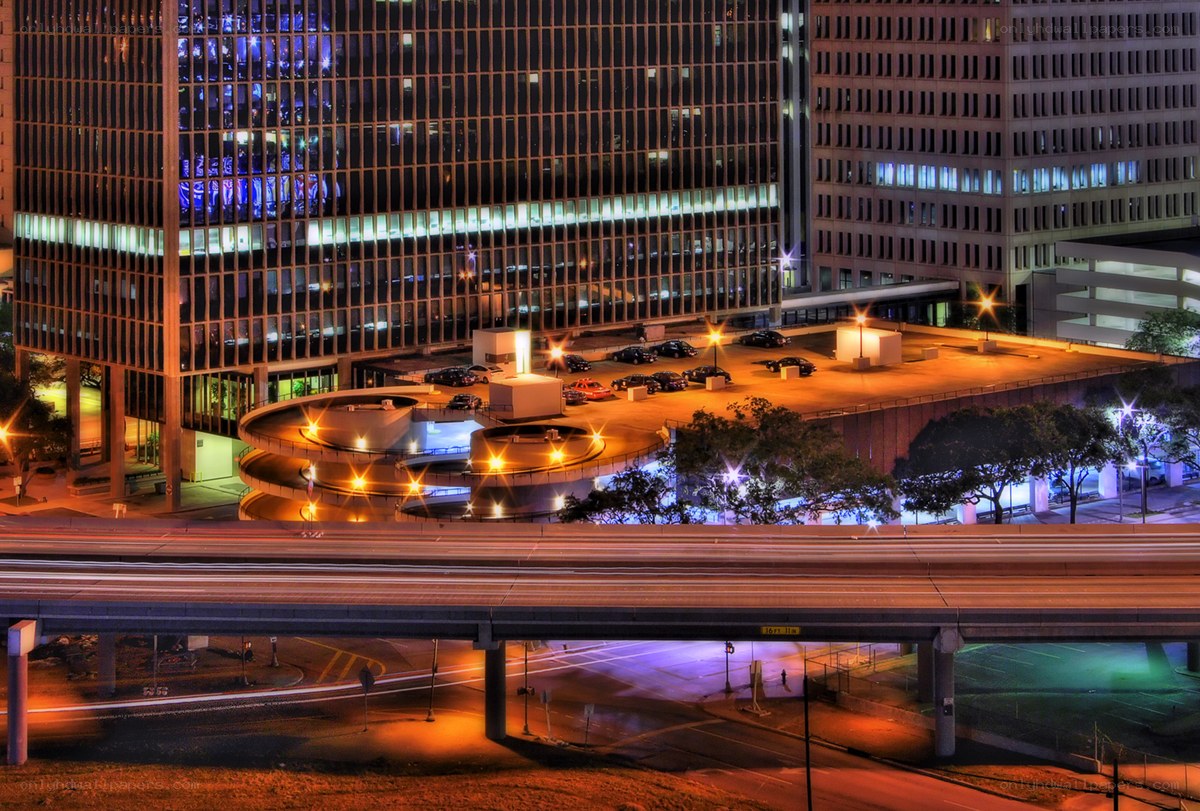Nighttime cityscape with parking garage