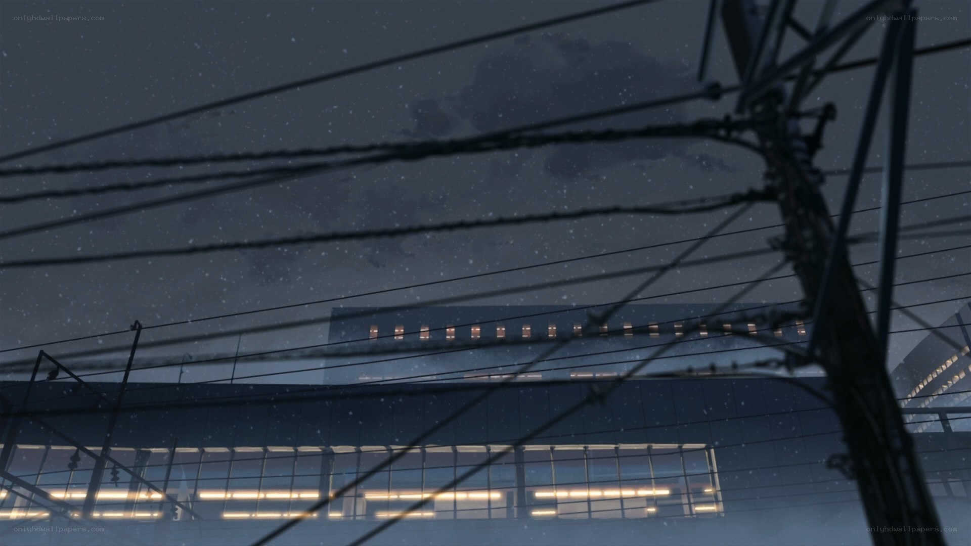 Nighttime cityscape with power lines
