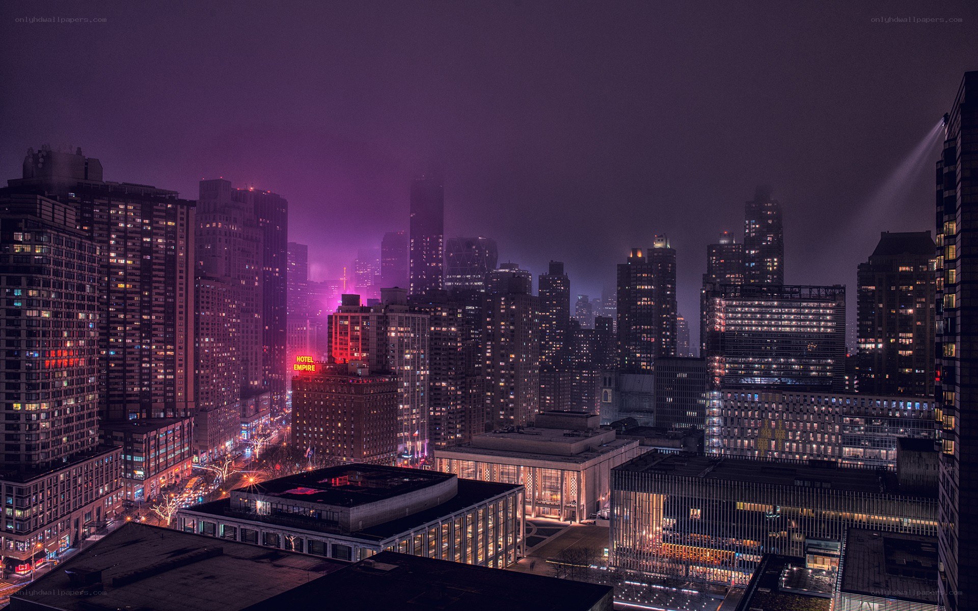 nighttime cityscape with purple lights