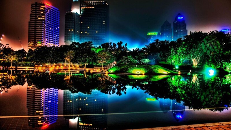 nighttime cityscape with reflections