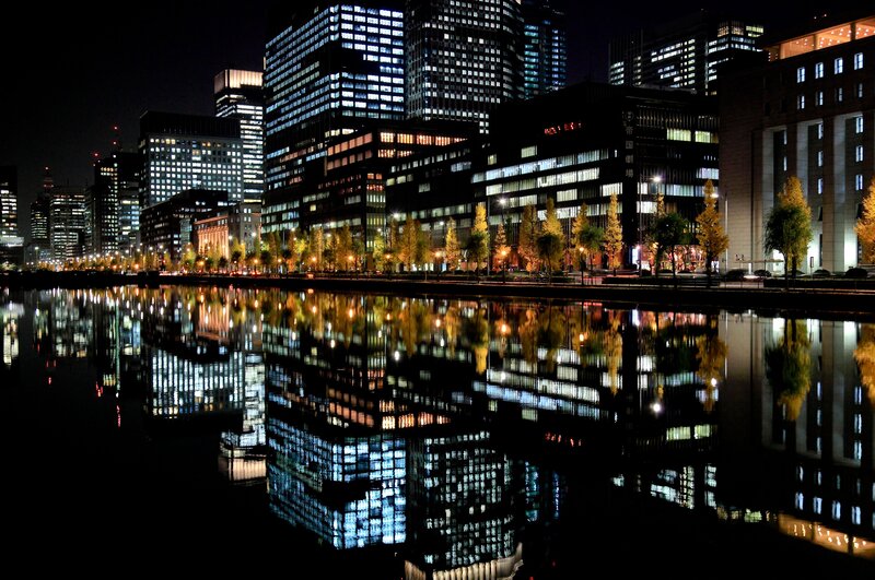 nighttime cityscape with reflections