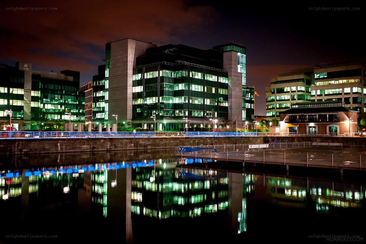 nighttime cityscape with reflections