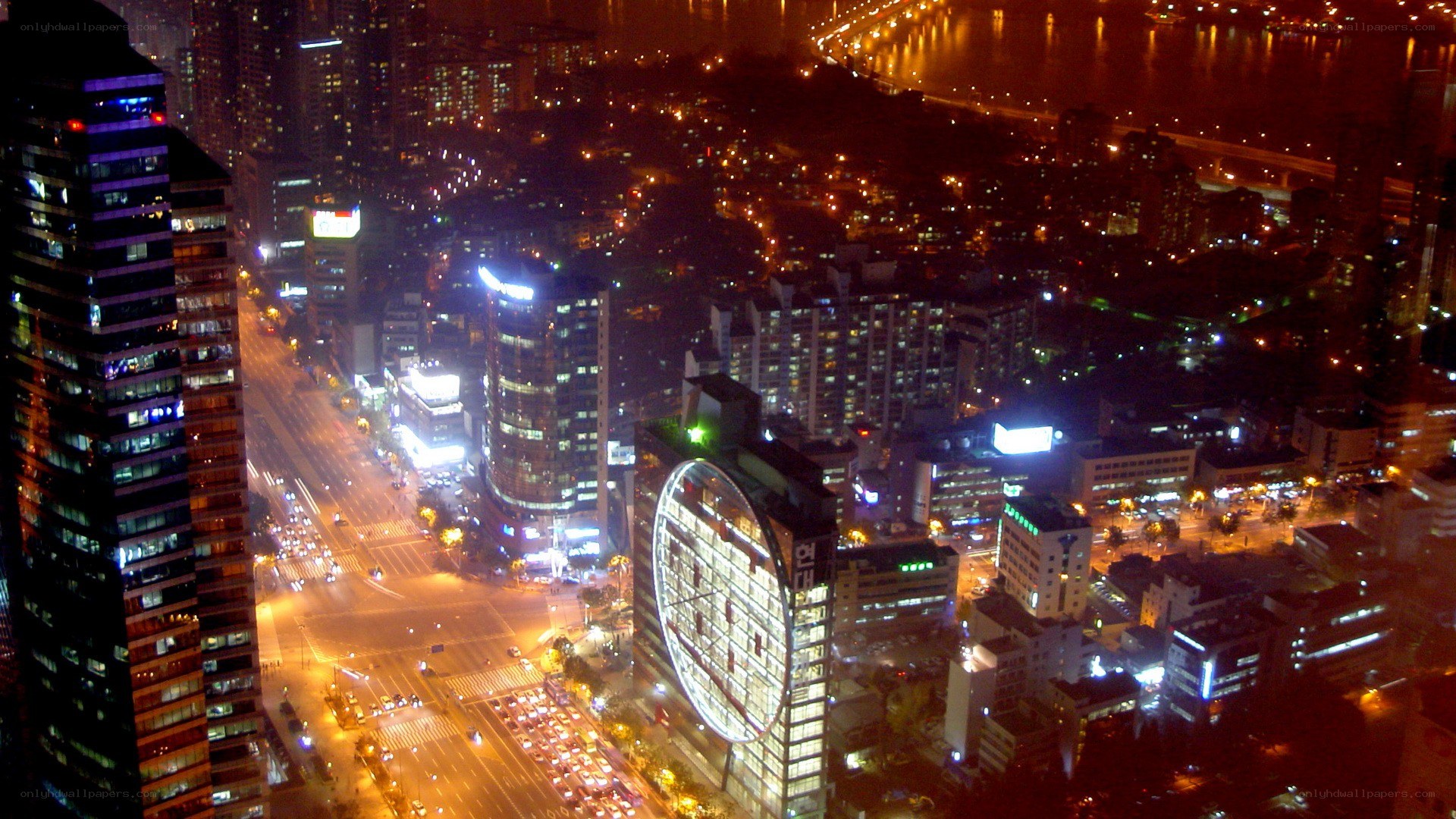 nighttime cityscape with river