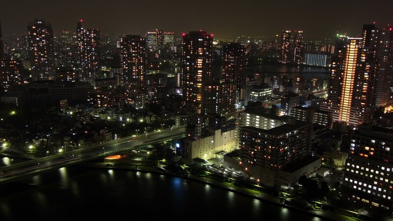 nighttime cityscape with river