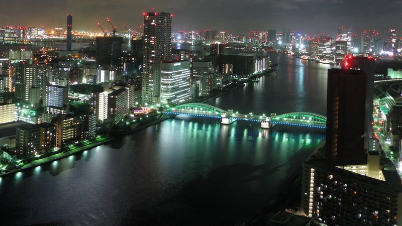 Nighttime Cityscape with River — Black, Calm, Night, Photograph, Bridge, Skyscrapers