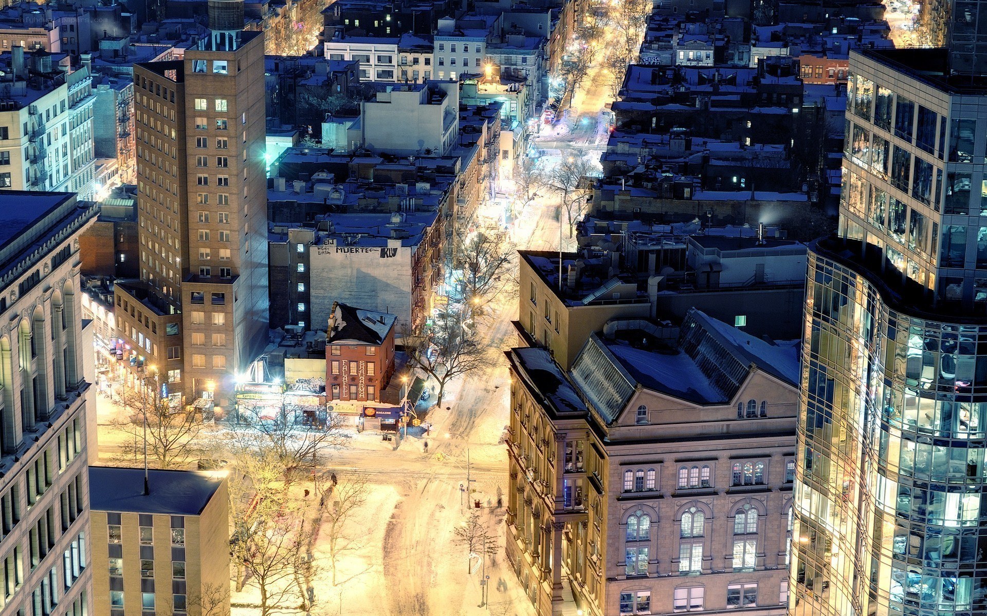 nighttime cityscape with snow