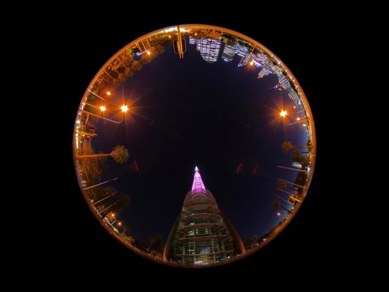 nighttime cityscape with tower
